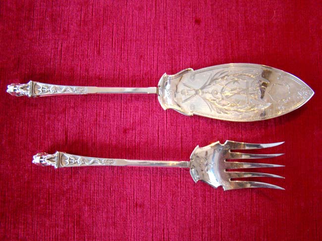 A FABULOUS maritime themed serving fork and fish slice with Poseidon's head made in 1861